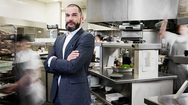 My Million Pound Menu TV Show featuring a man in a suit standing in a restaurant kitchen